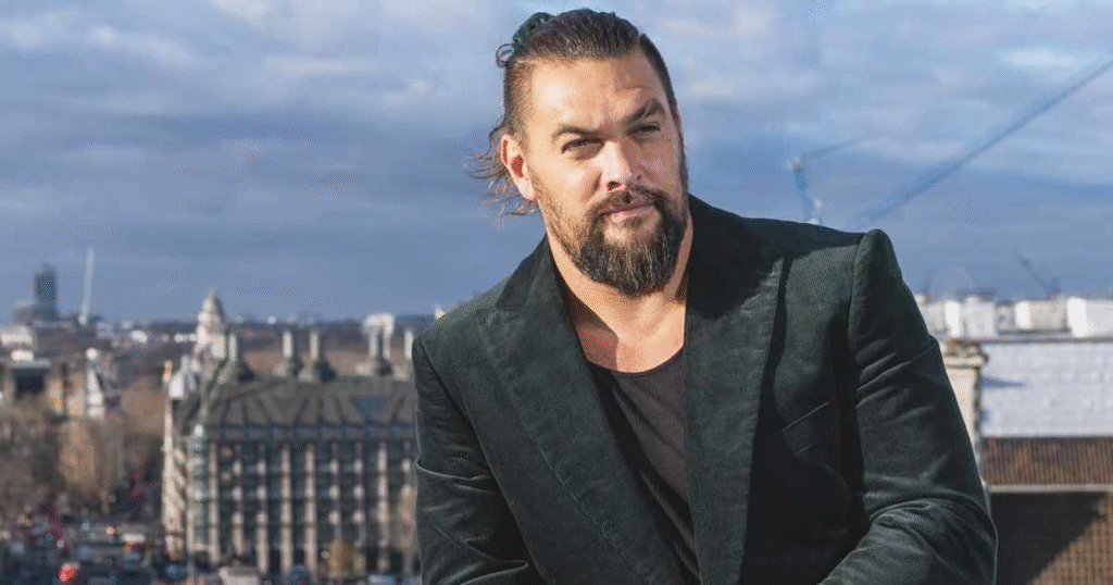 Jason Momoa Net Worth insights – Aquaman actor smiling at premiere