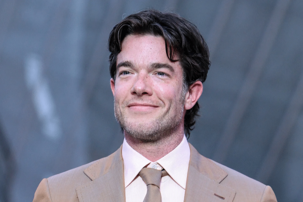 John Mulaney in a comedy sketch contributing to his net worth